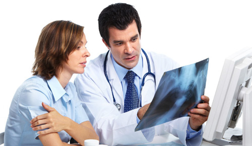 Doctor reviewing x-ray with patient