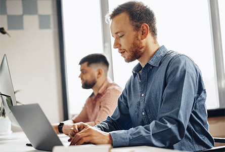 men working at labtops