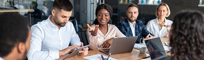 A group of business professionals having a discussion.