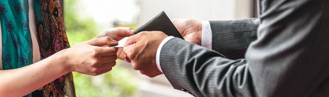 close up of two people exchanging something