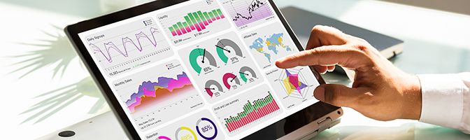 Small business owner analyzing metrics on a tablet device.