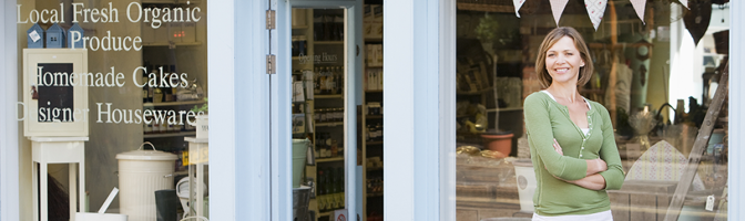 Woman working in local shop downtown store front