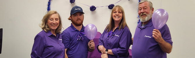 Sparklight employees gathered inside of Borger, TX Sparklight office storefront