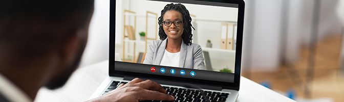 Two people in a video conference.