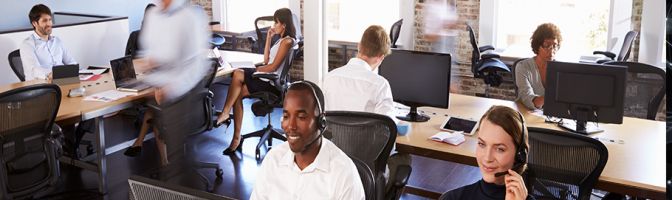 Office workers at their desks on the phone