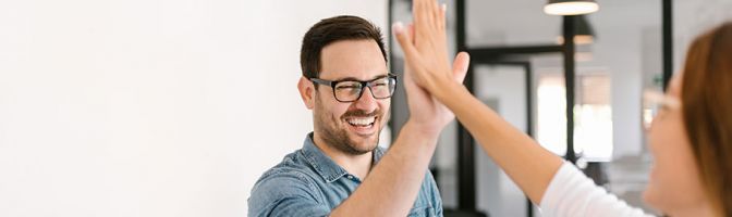 man high fiving a woman