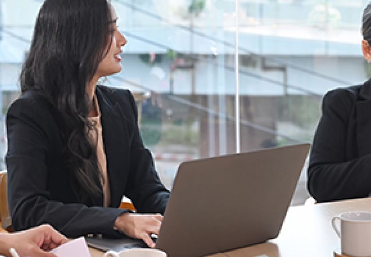 A business meeting with three people.