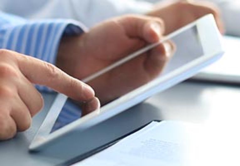 Man using tablet during meeting