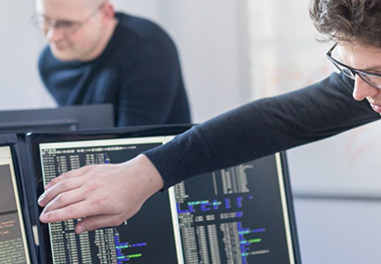 woman pointing out something on a computer screen