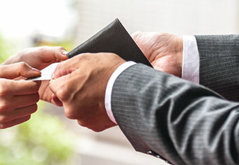 close up of two people exchanging something