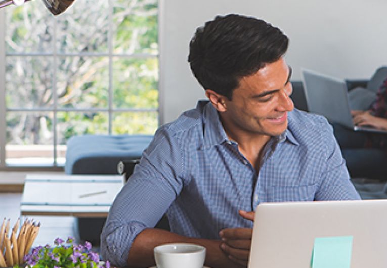 Home Business Owners working remotely while child at home.