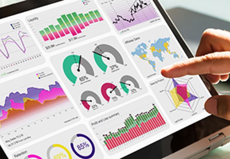 Small business owner analyzing metrics on a tablet device.