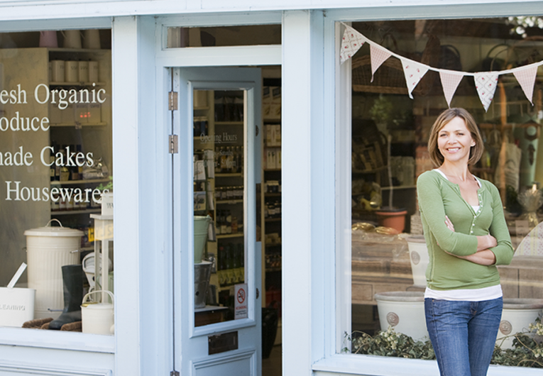 Woman working in local shop downtown store front