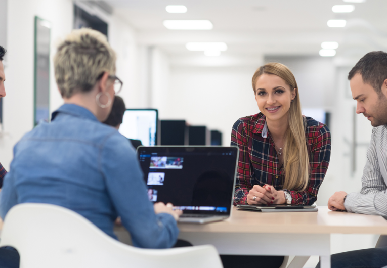 startup business team on meeting in modern bright office interior brainstorming, working on laptop and tablet computer