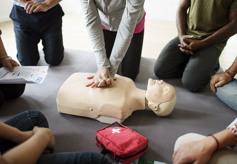 Group of employees doing CPR training