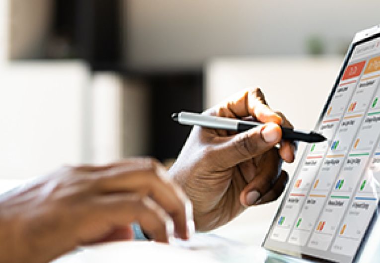 A small business owner uses a project management platform to streamline tasks.