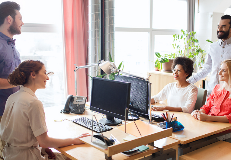 happy creative team talking in office