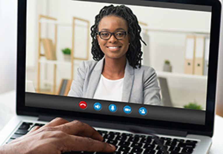 Two people in a video conference.