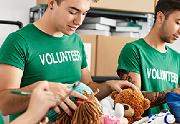 Employees of a business volunteer at a shelter.