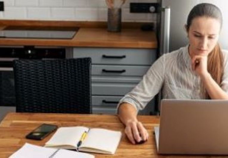 Woman conducting research on laptop