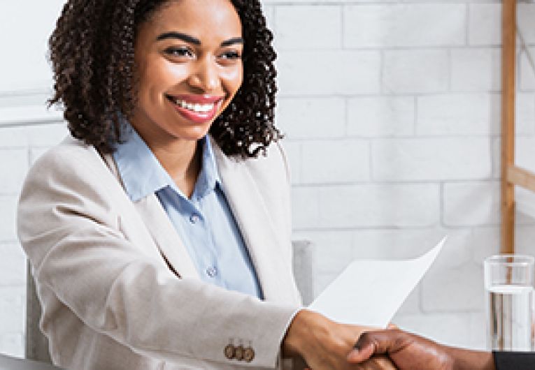 Two people shaking hands.