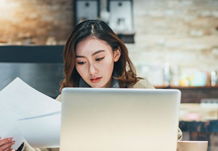 woman-looking-at-papers