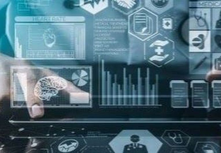 Business person in front of a laptop with superimposed security icons 
