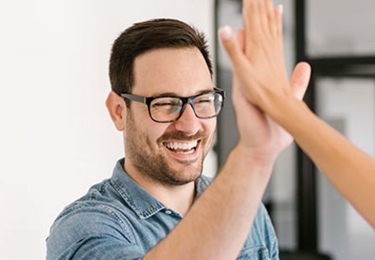 man high fiving a woman