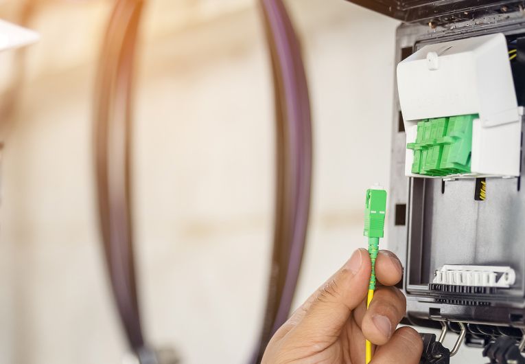 Technician installing fiber optic internet