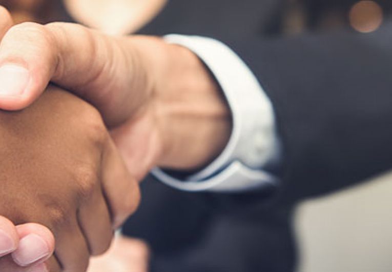 closeup of two people shaking hands