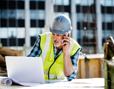 construction worker on cell phone