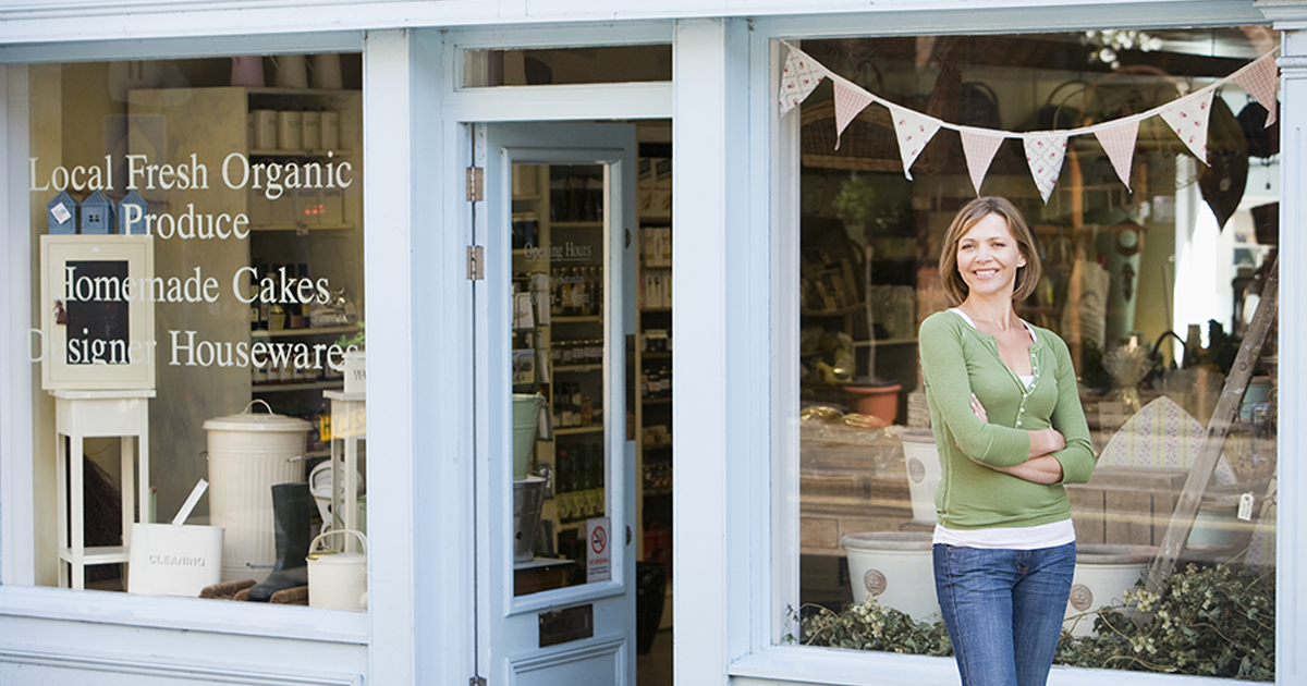 Woman working in local shop downtown store front