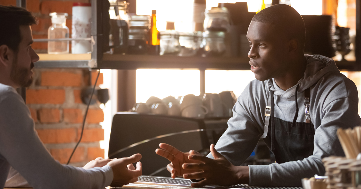 Restaurant worker owner interviewing new hire candidate for seasonal opening