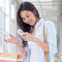 A woman interacting with her smartphone.